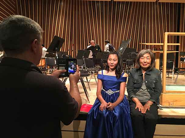 Student with piano teacher